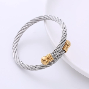 Brazalete de cable de acero inoxidable bicolor con puntas de bola doradas estilo punk