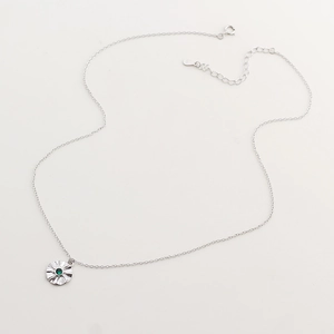 Detailed view of S925 sterling silver star necklace with green emerald gemstone