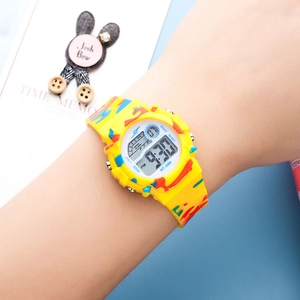 Kids digital sports watch with yellow camouflage strap and colorful LED luminous display