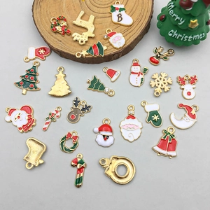 Detailed flat lay of festive Christmas alloy charms including Santa and reindeer