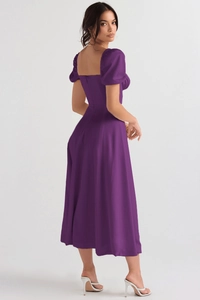 Detail view of the elegant purple satin dress with puff sleeves and square neckline