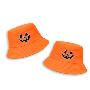Detail of orange cotton bucket hat featuring embroidered Jack O' Lantern pumpkin faces