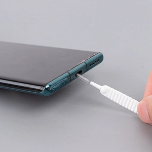 Miniature cleaning brush for shower heads and phone charging ports with non-slip handle