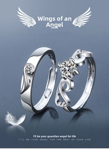 Macro shot of silver feather rings with diamond settings and polished metallic texture