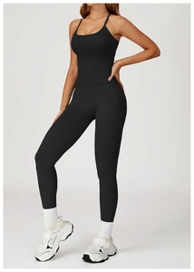 Detail of a seamless black yoga set with spaghetti straps and high-waist compression leggings