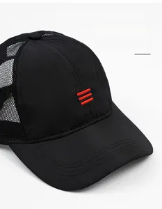 Detail of black mesh baseball cap showing breathable fabric and red striped embroidery