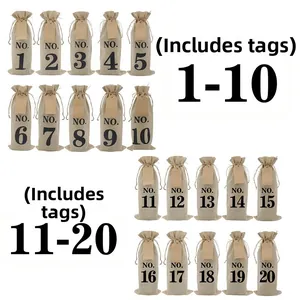 Close-up of 20 natural linen wine bags with black numbers and kraft paper gift tags