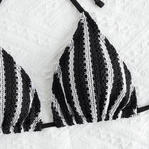 Close-up of black and white striped crochet triangle bikini top with tie straps