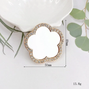 Floral crystal compact mirror with gold trim and white rhinestones, dimensions 49x50mm