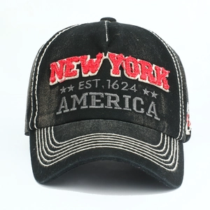 Detail of vintage washed cotton cap featuring red 3D New York embroidery and star crest