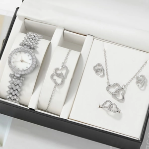 Detail view of silver heart jewelry set with watch and crystals in a gift box