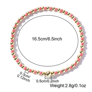 Elastic beaded bracelet with gold and pink beads featuring dimensions and weight specs