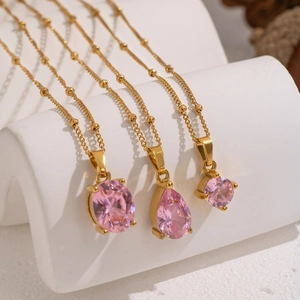 Minimalist gold plated necklaces featuring pink oval, teardrop, and round zircon pendants