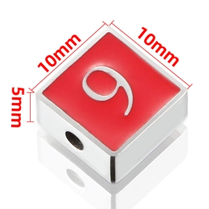 Macro detail of red enamel number 9 square bead with 10mm dimensions for DIY jewelry