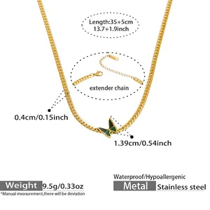 Detail of gold Cuban chain necklace with green butterfly pendant and dimensions