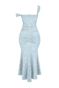 Detail of light blue lace mermaid dress featuring back pleats and asymmetric neckline