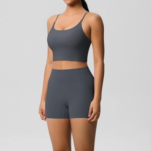 Detail of charcoal grey yoga set featuring thin strap sports bra and high waist shorts