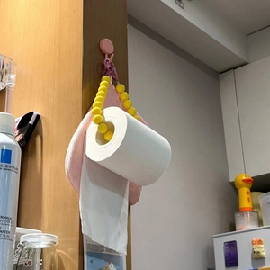 Pink plush roll tissue holder with vibrant yellow large beads handle for wall mounting