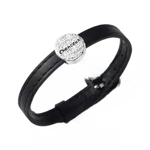 Close-up of S925 sterling silver circular charm with Chanceux engraving on black leather cord