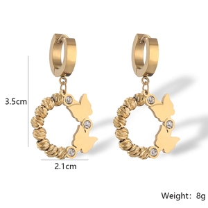 Detailed view of gold butterfly earrings with crystals, measuring 3.5cm by 2.1cm