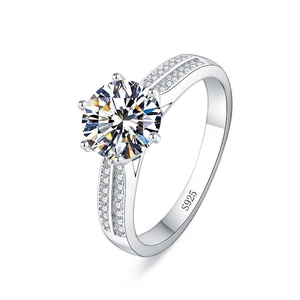 Macro shot of S925 silver ring featuring a six-prong setting and pavé set side stones