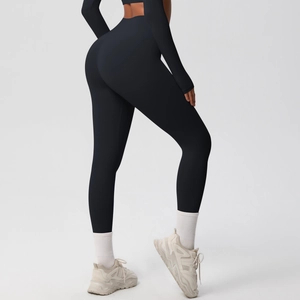 Detailed back view of high-waisted black yoga leggings showing butt lifting and shaping effect