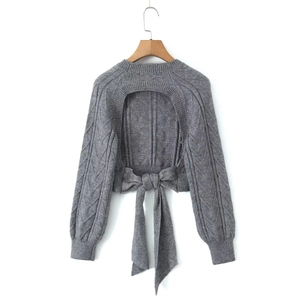 Grey cable knit sweater with a sexy backless design and a large ribbon bow accent