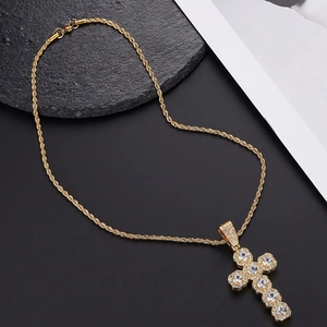 Gold iced out cross pendant necklace with micro paved cubic zirconia and rope chain
