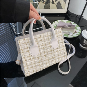 White and gold checkered tweed handbag with leather handle and long shoulder strap