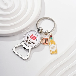 Detail of silver bottle opener keychain with Dad You are My Hero and beer mug charms