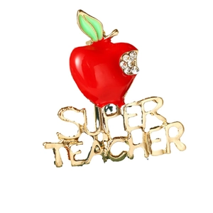 Sparkling red apple brooch with Super Teacher text and rhinestones on white background