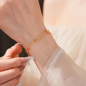 Vintage golden hollow sunflower double-chain bracelet for women with elegant design
