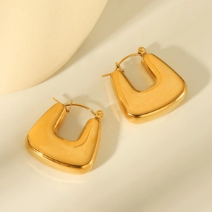 Minimalist gold hollow U-shaped hoop earrings with polished thick metallic texture