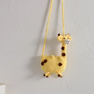 Handmade knitted giraffe crossbody bag for toddler girls in bright yellow and brown
