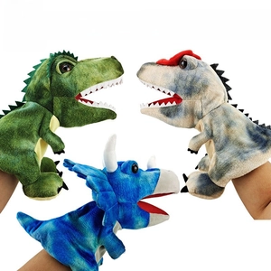 Detailed close-up of three dinosaur hand puppets featuring realistic teeth and soft plush fabric