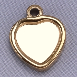Macro detail of a 304 stainless steel heart pendant with gold finish and textured edges