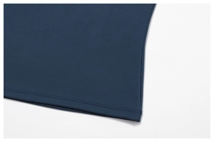 Detailed close-up of navy blue athletic fabric showing smooth knit texture and double stitching