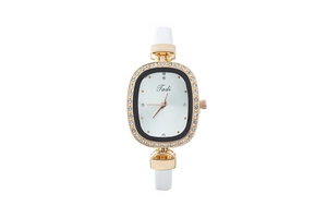 Detail of rose gold oval watch with crystal bezel and white leather strap
