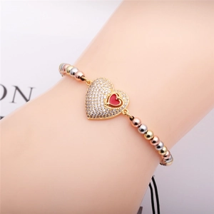 Adjustable 4mm copper bead bracelet with tricolor gold finish and red heart charm