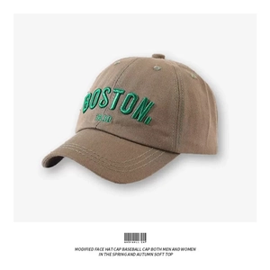 Close-up of vintage brown cotton baseball cap with green Boston 1630 embroidery