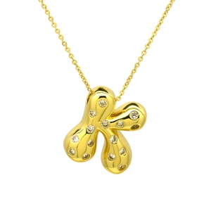 Detailed close-up of a gold-plated puffed flower pendant with sparkling cubic zirconia