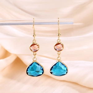 Detailed view of teardrop copper earrings with blue and pink faceted crystals for women