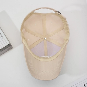 Classic beige cotton canvas baseball cap featuring six-panel structure and metal buckle