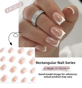 French tip press-on nails in nude pink with white edges and glossy rectangular finish