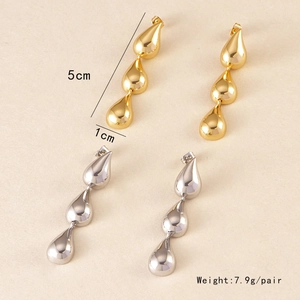 Detail view of teardrop earrings in gold and silver showing 5cm length dimensions