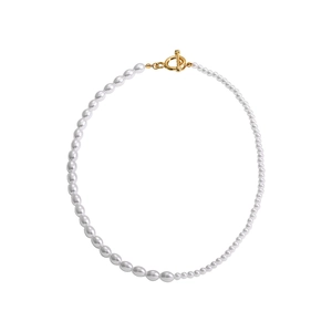 Bohemian style necklace with white baroque pearls and a golden OT toggle clasp on white background