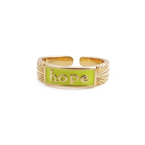 Detail view of gold-plated adjustable ring featuring lime green enamel and Hope engraving