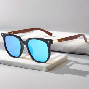 Detail of retro polygon sunglasses with blue mirror lenses and wood grain temples