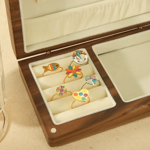 Bohemian colorful enamel stainless steel open rings displayed in a wooden jewelry box