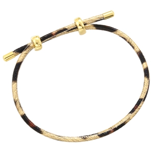 Close-up of leopard pattern cord bracelet with gold metal clasp and adjustable slider